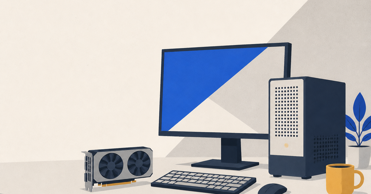 Desktop tower, monitor, and spare graphics card arranged on a desk for hardware testing.